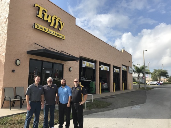 Pictured in the photo from left to right (Barry Unrast – T.A.C. Director of Marketing, Craig Gantner – Tuffy Franchisee, Jay Fernandez – Tuffy Franchisee, and Scott Linde – T.A.C District Manager).